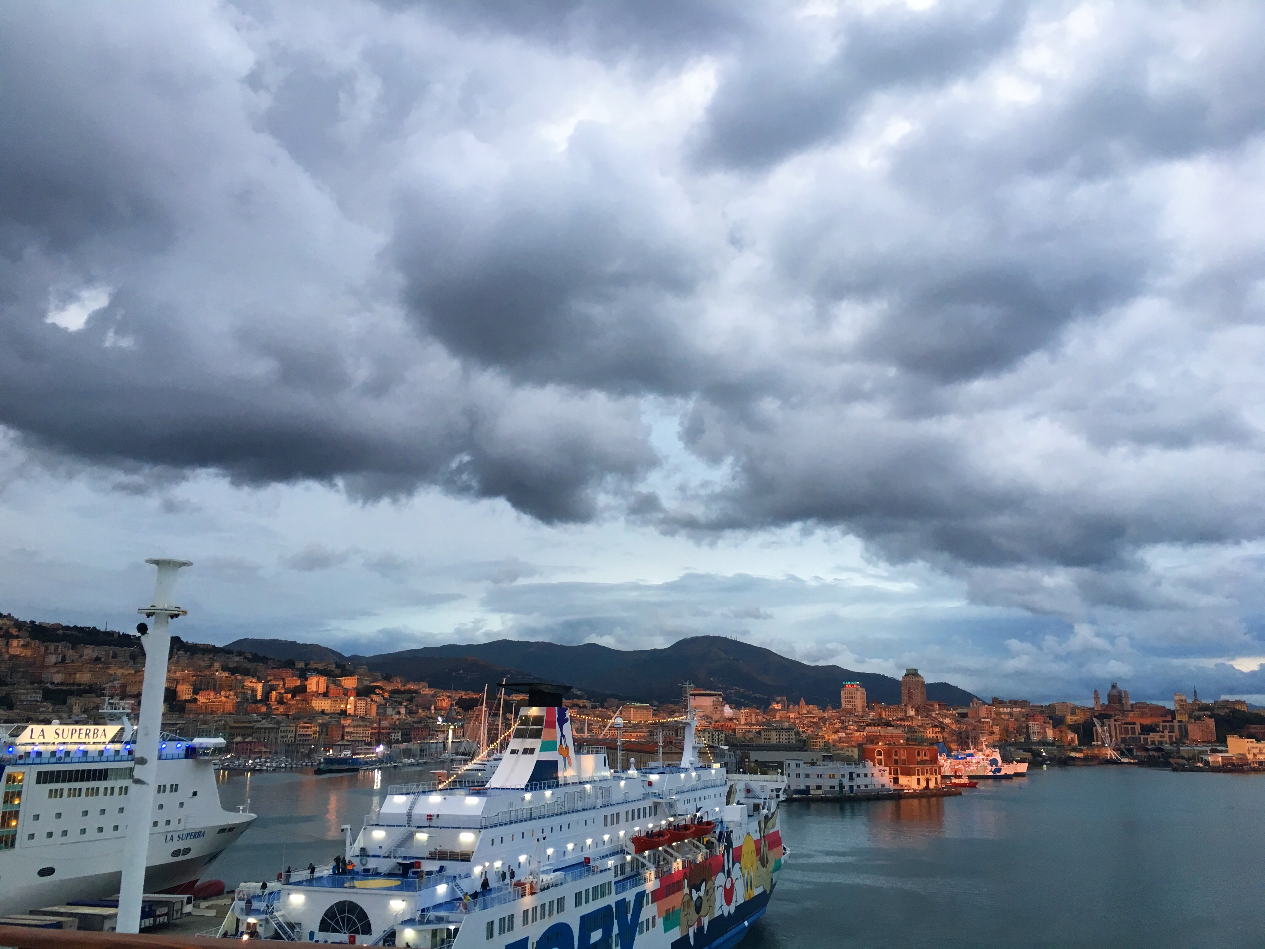 Boarding an overnight ferry from Genova to Sardinia, I say my farewell to a beautiful city and explore the Rhapsody, a ship of Grandi Navi Veloci company.